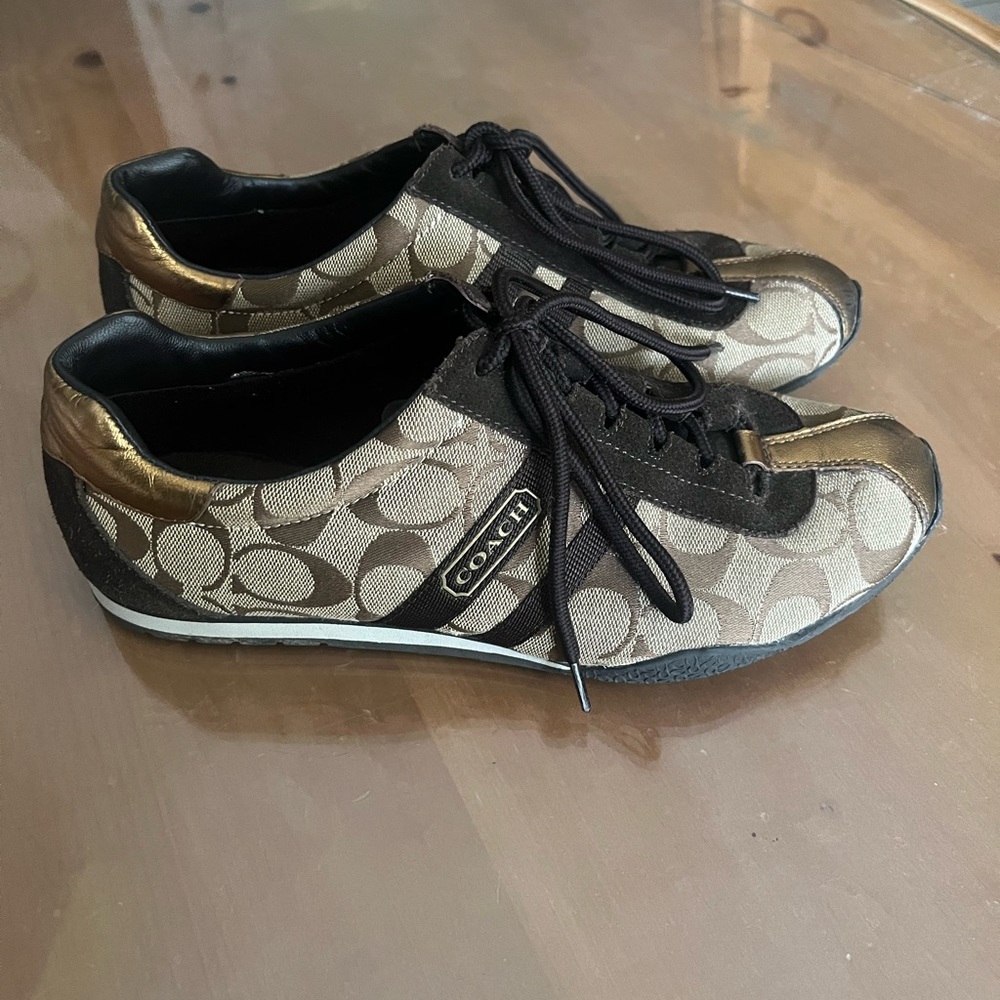 Brown and Gold Coach sneaker, size 10. In good condition